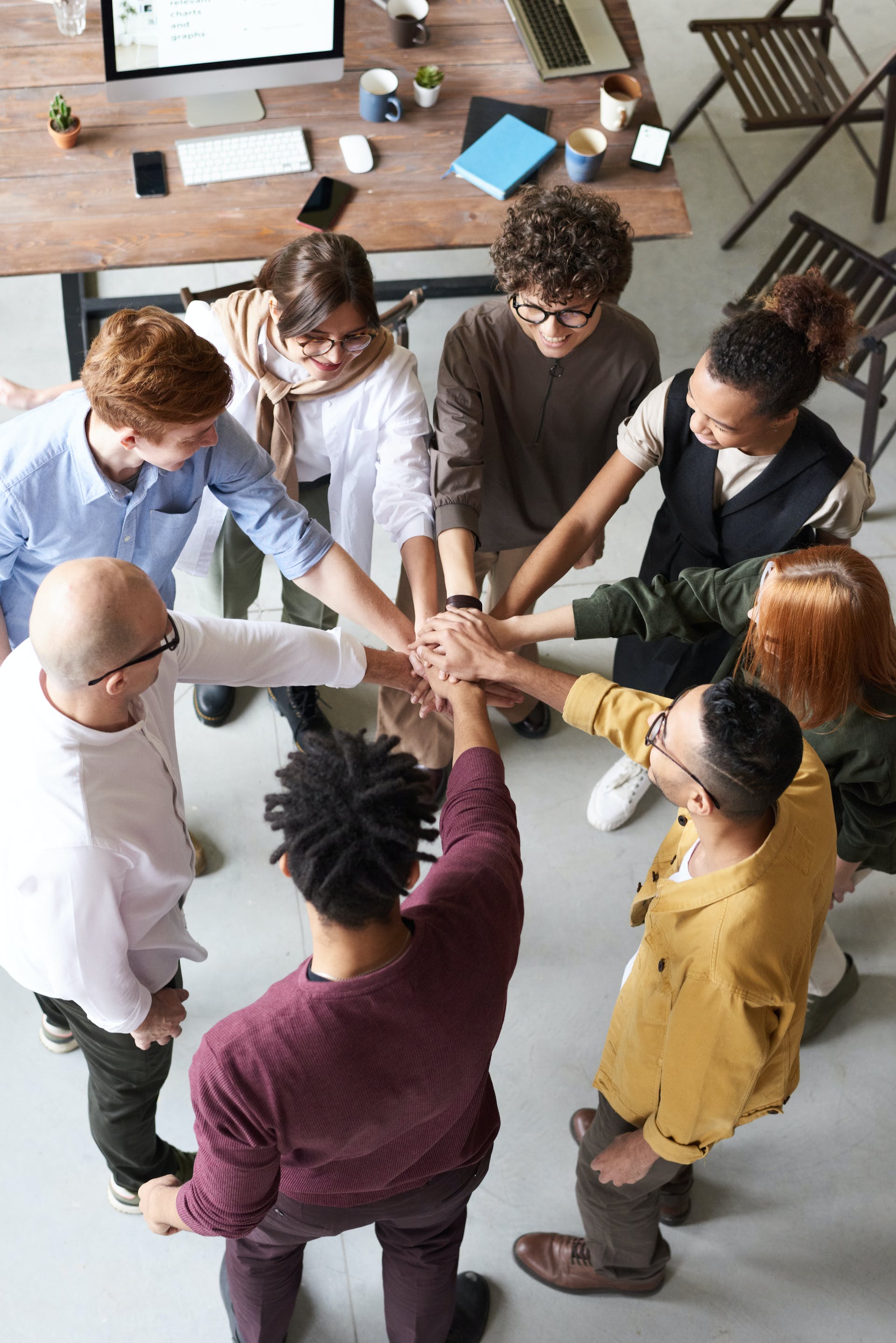 group hands in